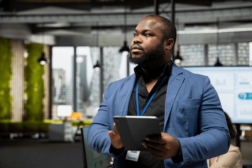 Wholesale business owner reviewing branch analytics